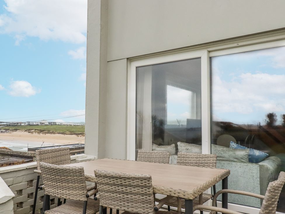 A balcony with a table and chairs at Surf View in Newquay