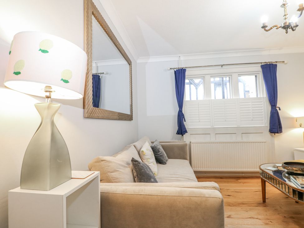 A living room with a sofa and lamp at The Old School House in Windsor