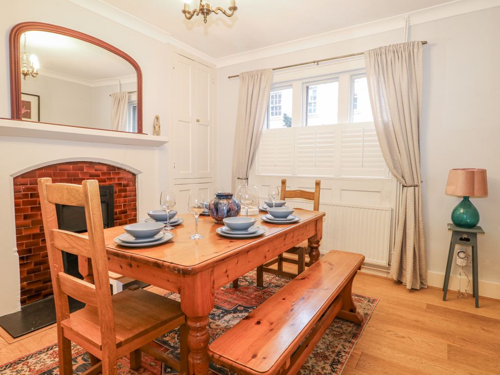 A dining room with a table set for a meal at The Old School House in Windsor