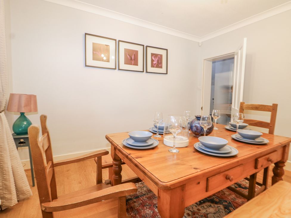 A dining room with a table set for dinner at The Old School House in Windsor
