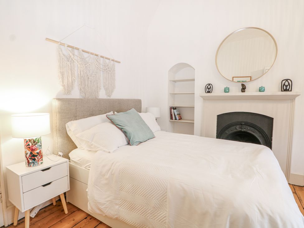 A bedroom with a bed and a lamp at The Old School House in Windsor