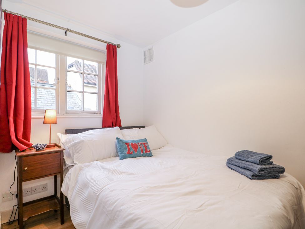 A bedroom with a bed and bedside table at The Old School House in Windsor