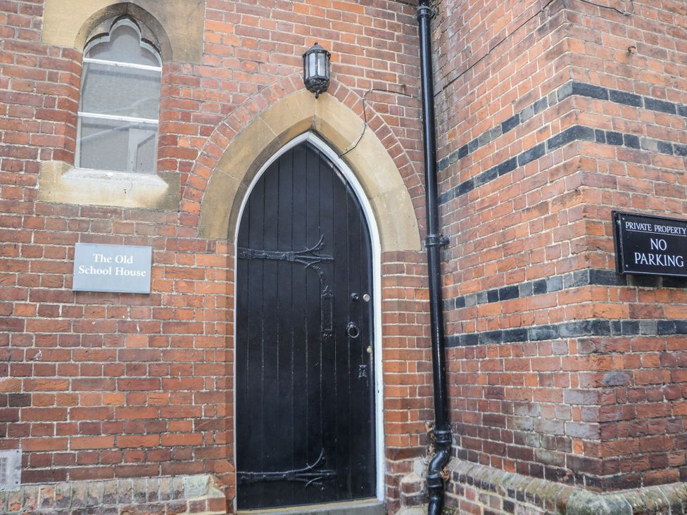 A door and window on a brick wall at The Old School House in Windsor