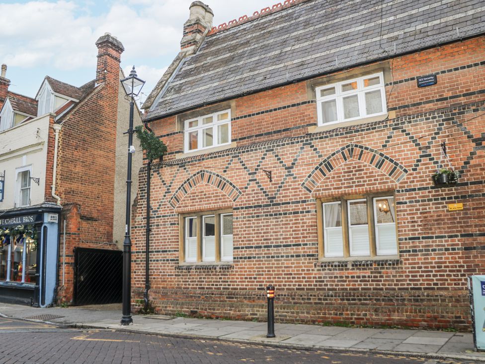 A building facade with windows and brickwork patterns at The Old School House in Windsor