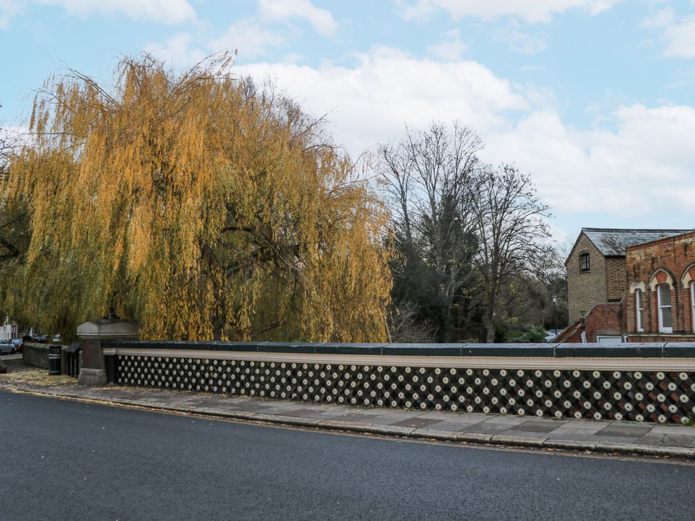 A view of a bridge with a tree and building at The Old School House in Windsor