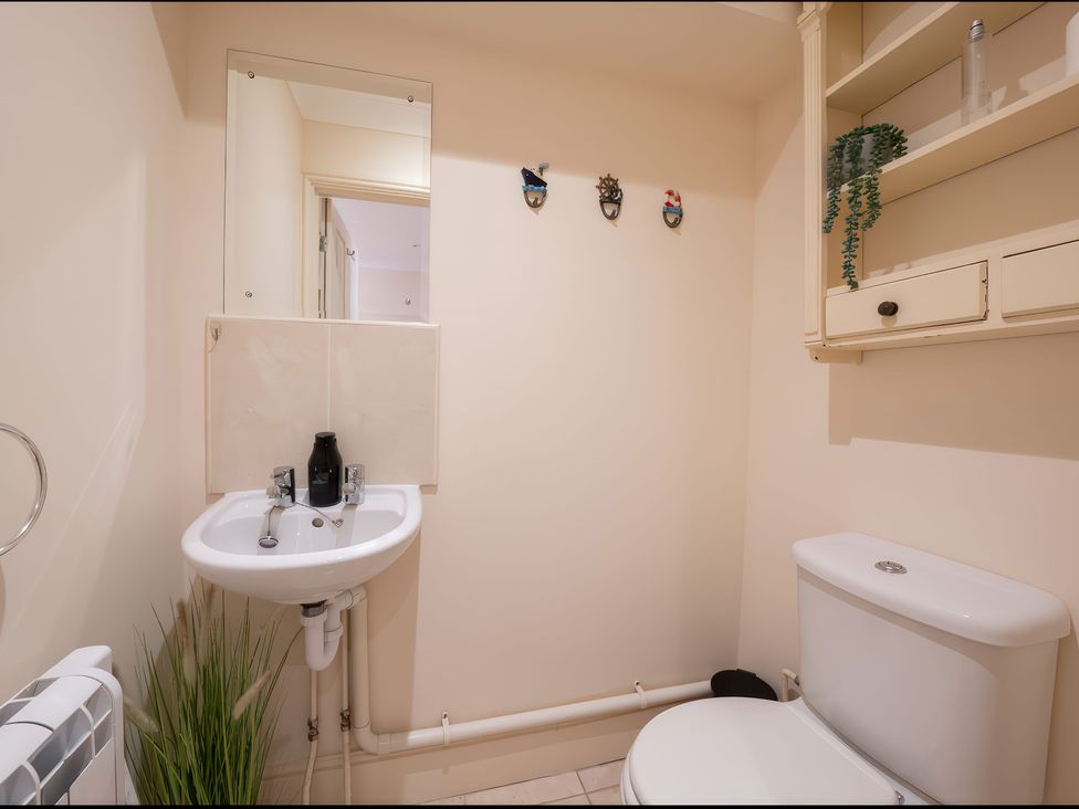 A bathroom with a sink and a toilet at 17 Solent Landing in Bembridge