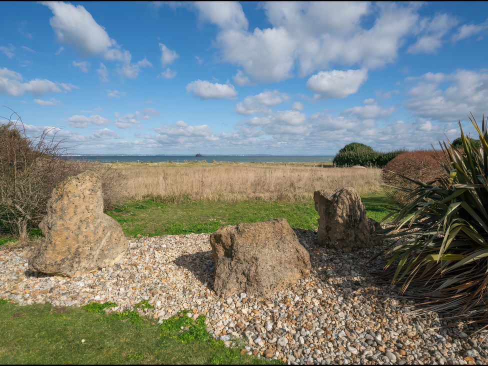 Outdoor view with rocks and grass at 17 Solent Landing in Bembridge