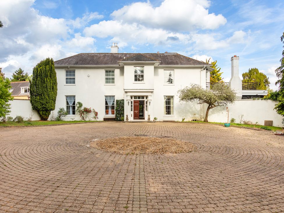 A house with a driveway and garden at Violet House in Iver