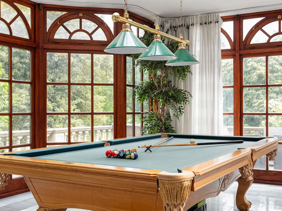 A snug with a pool table and windows at Violet House Iver