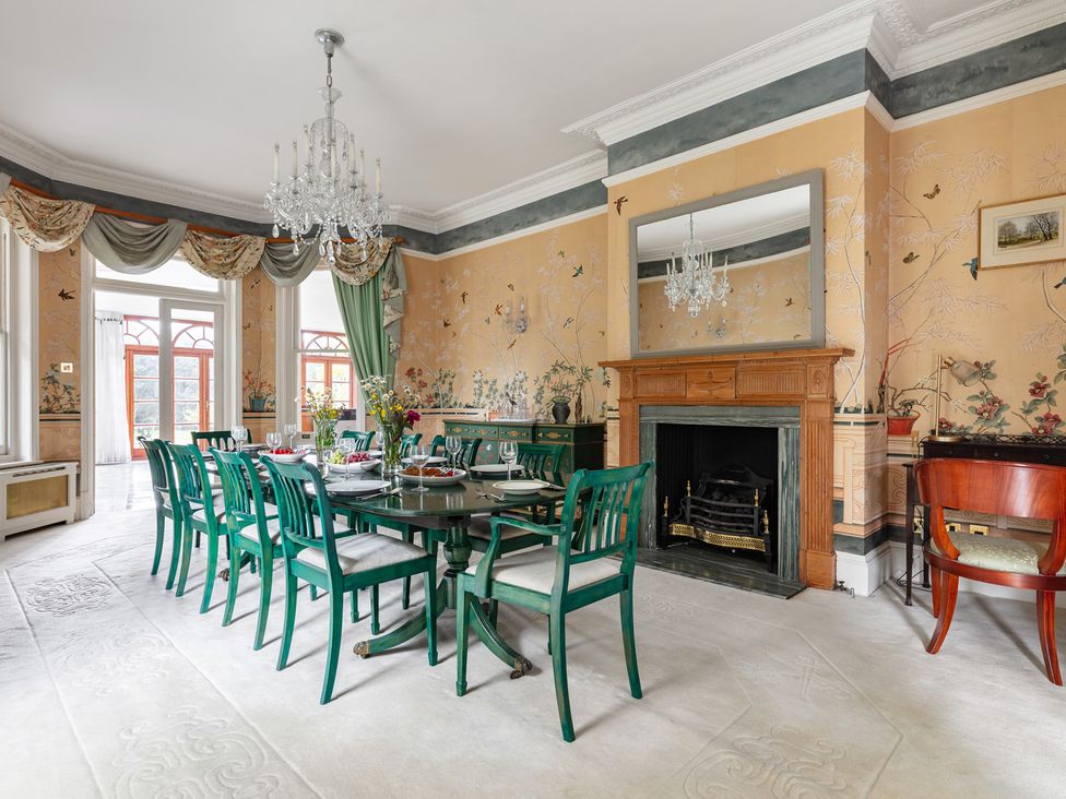 A dining room with a table and chairs at Violet House in Iver