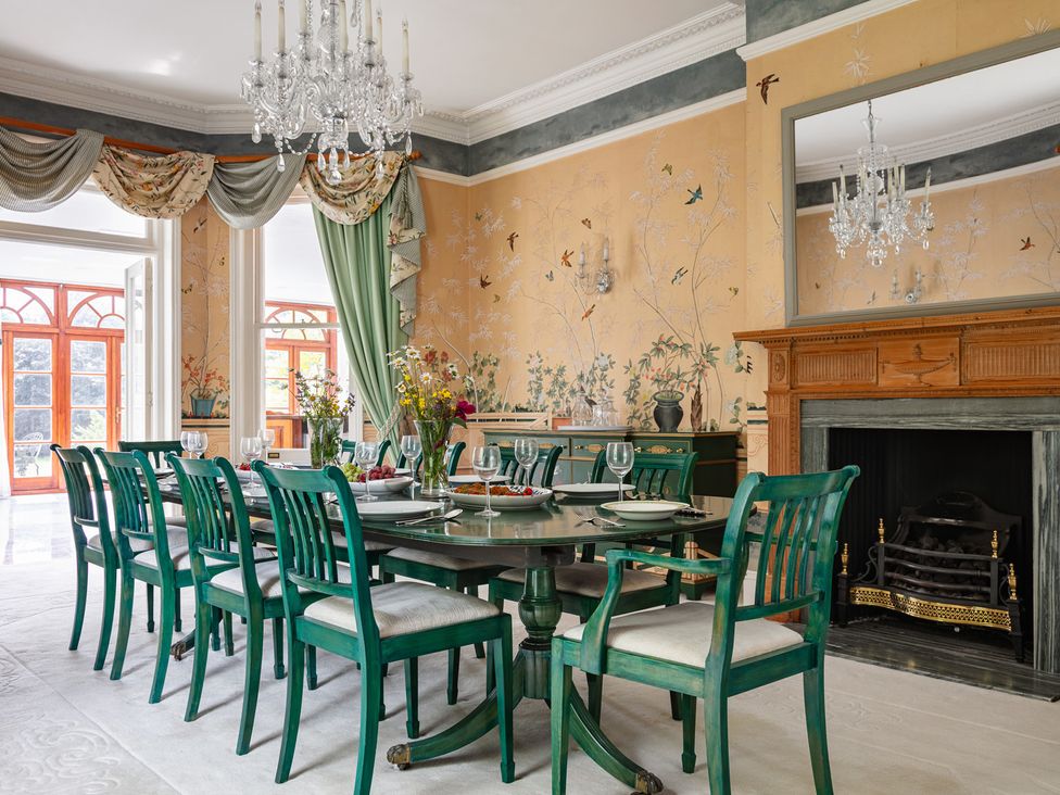 A dining room with a table and chairs at Violet House in Iver