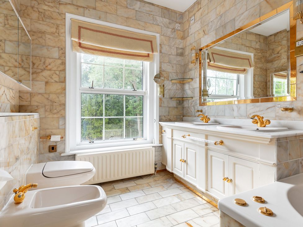 A bathroom with a sink and toilet at Violet House in Iver