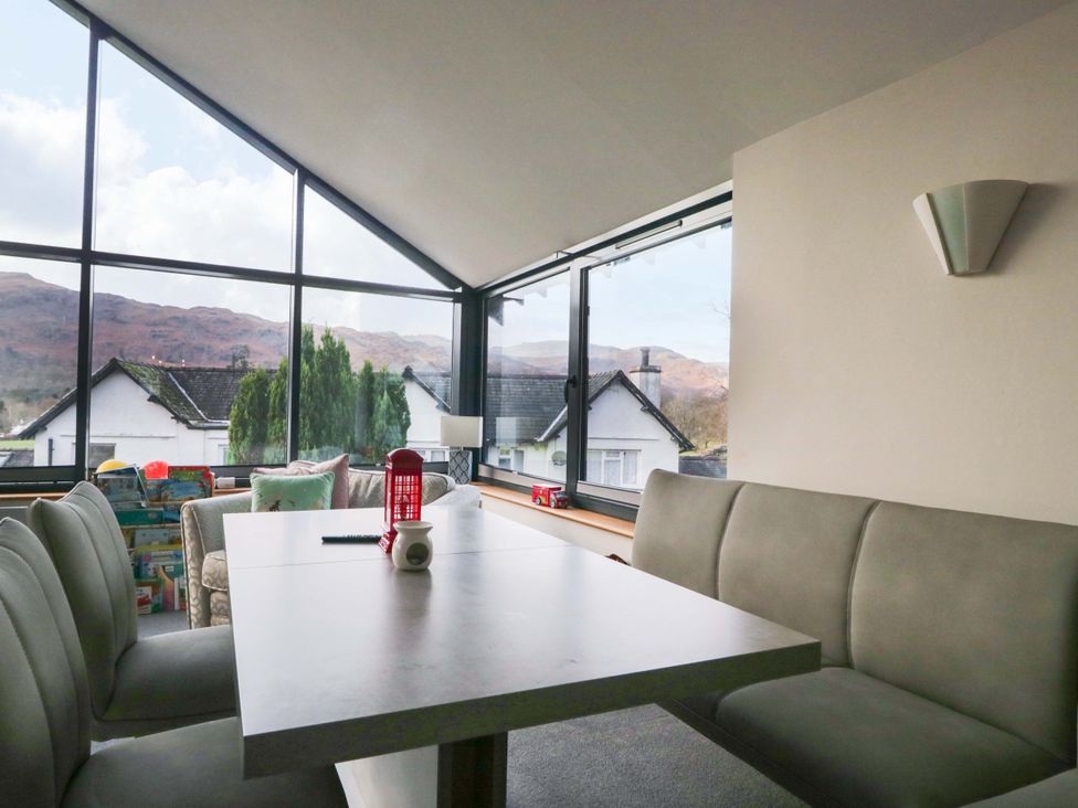 A dining room with a table and chairs at Two Hollens in Ambleside