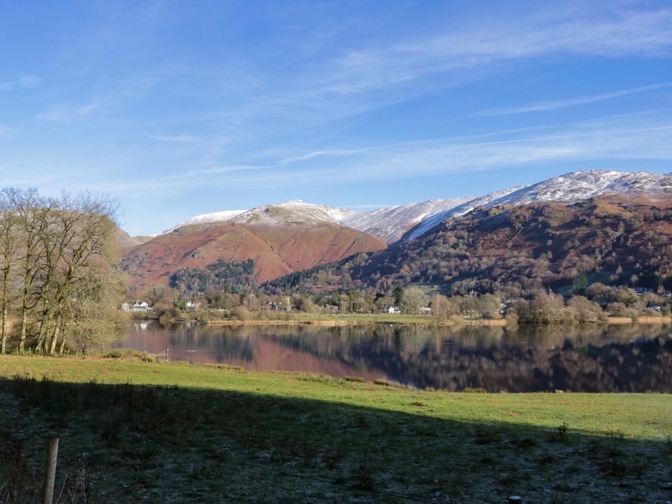 A view of mountains surrounding a lake at Two Hollens in Ambleside