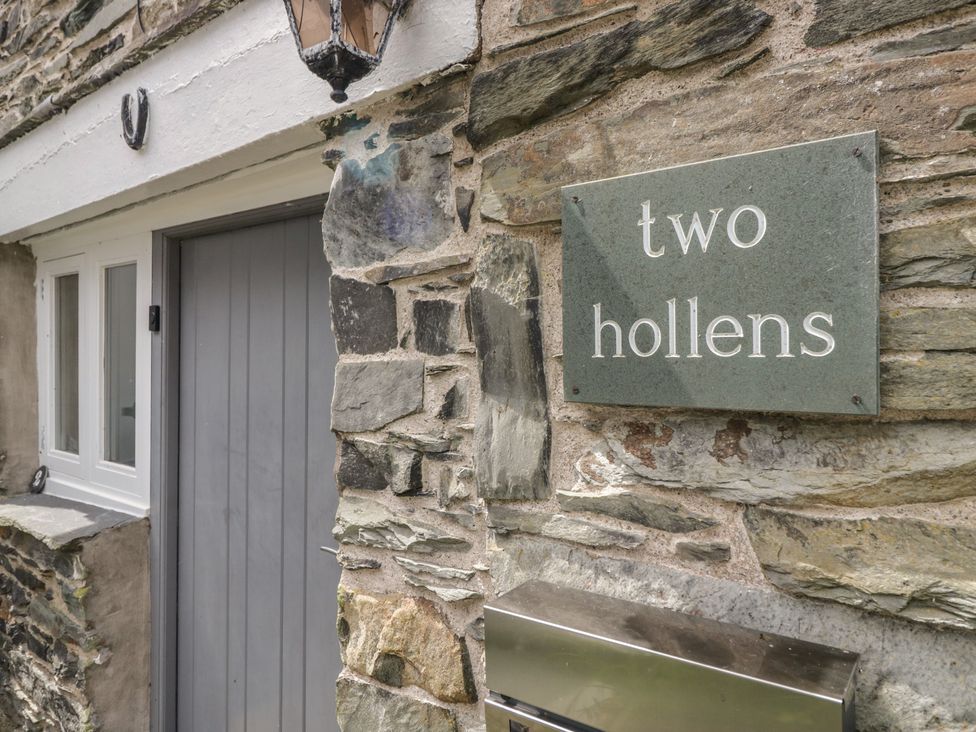Entrance with stone wall and door at Two Hollens in Grasmere