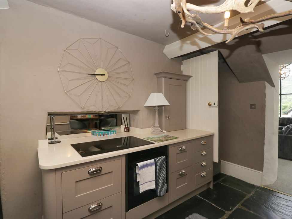 A kitchen with stove and sink at Two Hollens in Grasmere