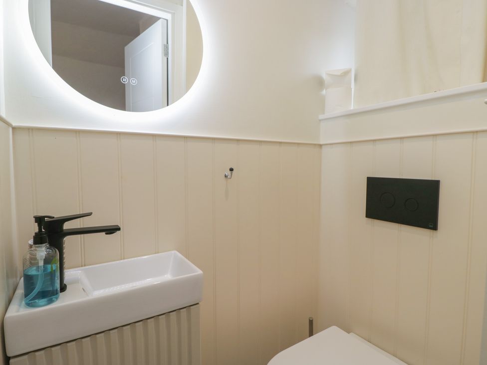A bathroom with a sink and toilet at Two Hollens in Grasmere