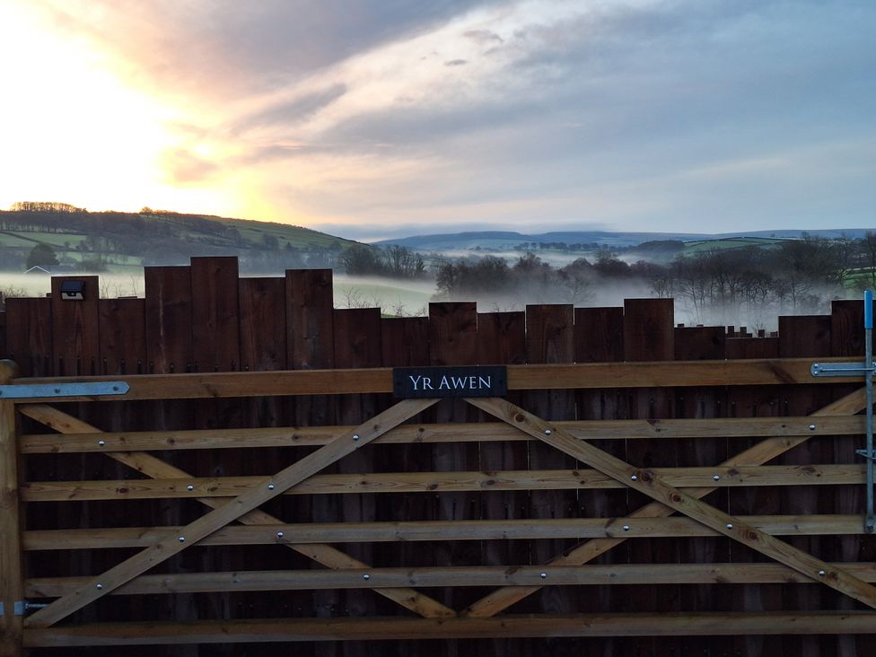 A gate with a sign at Yr Awen near Lampeter