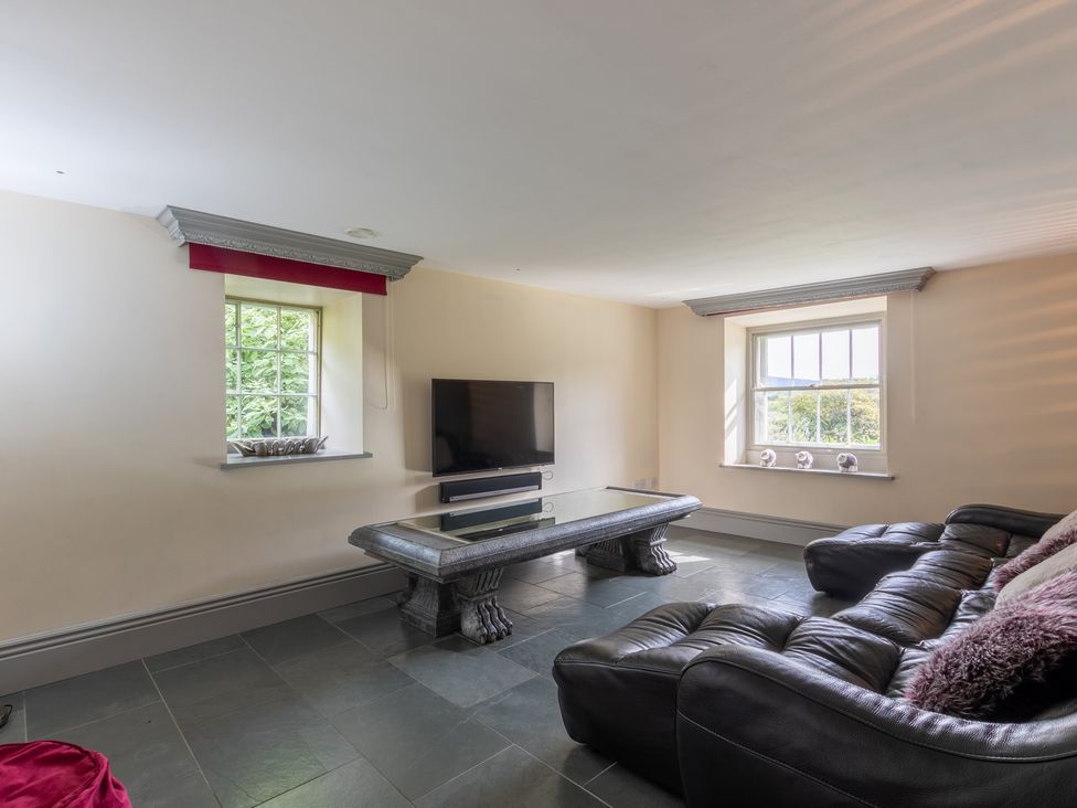 A living room with a sofa and television at Souterstead in Torver near Coniston