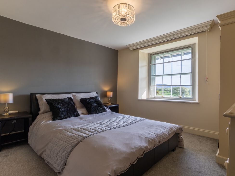 A bedroom with a bed and bedside tables at Souterstead near Coniston