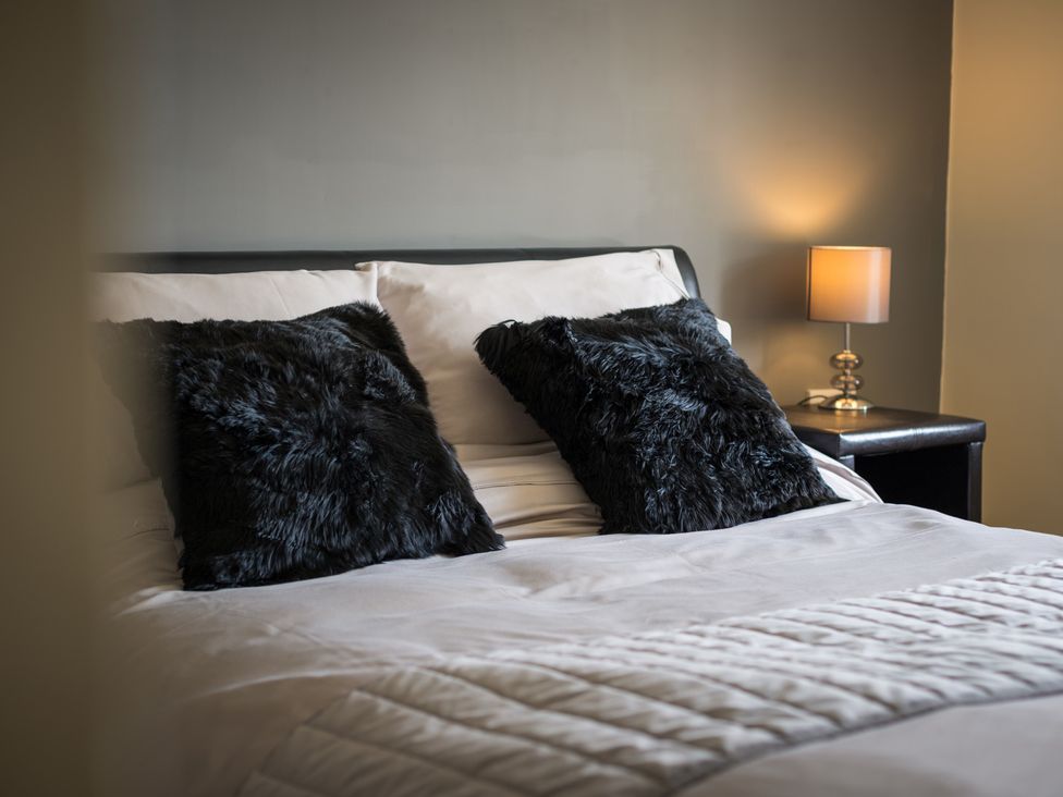 A bedroom with a bed and pillows at Souterstead in Torver near Coniston