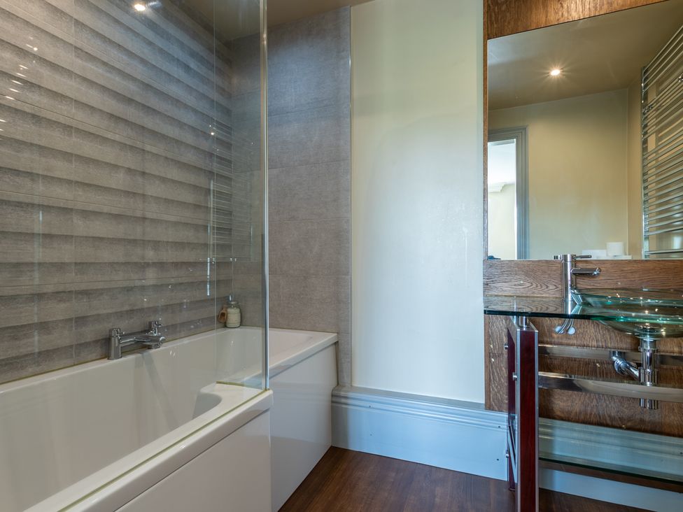 A bathroom with a bathtub and sink at Souterstead in Torver near Coniston
