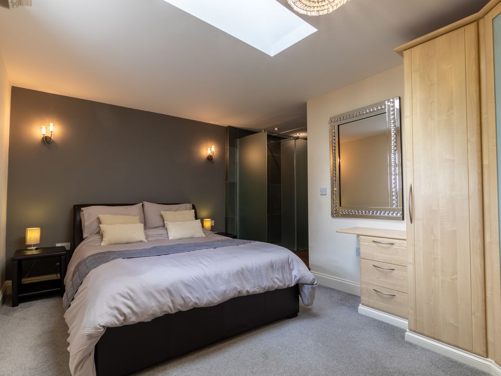 A bedroom with a bed and wardrobe at Souterstead in Torver near Coniston
