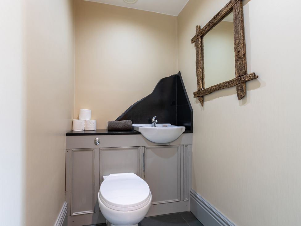 A bathroom with a toilet and sink at Souterstead in Torver near Coniston