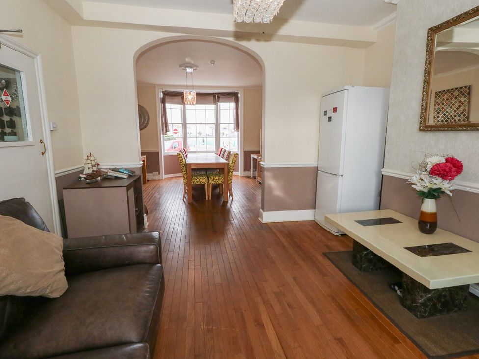 A dining room with a table and chairs at 9 The Esplanade 