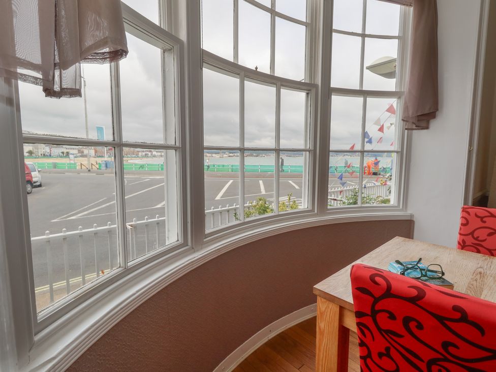 A dining room with a view of the sea at 9 The Esplanade 