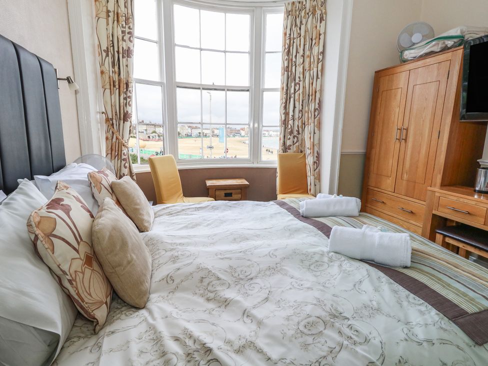 A bedroom with a bed and window at 9 The Esplanade