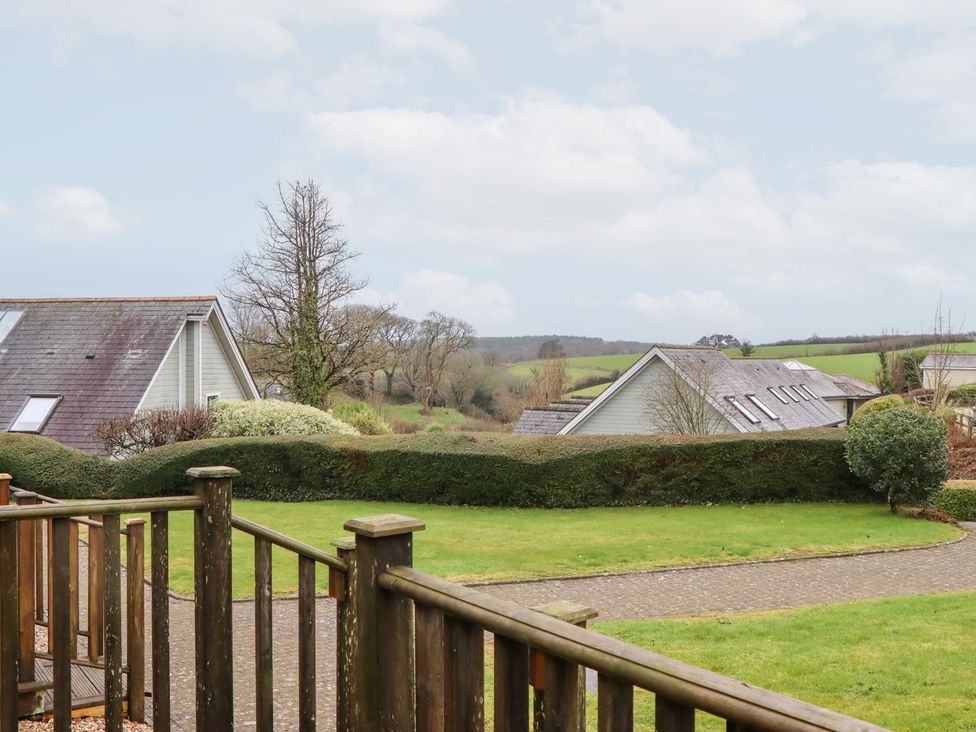 View of houses and trees from a patio at 3 Keepers Cottage