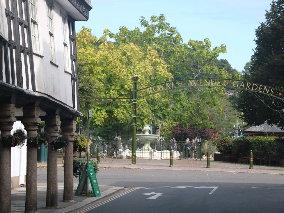 An outdoor view of Royal Avenue Gardens with a fountain and trees at 3 Keepers Cottage