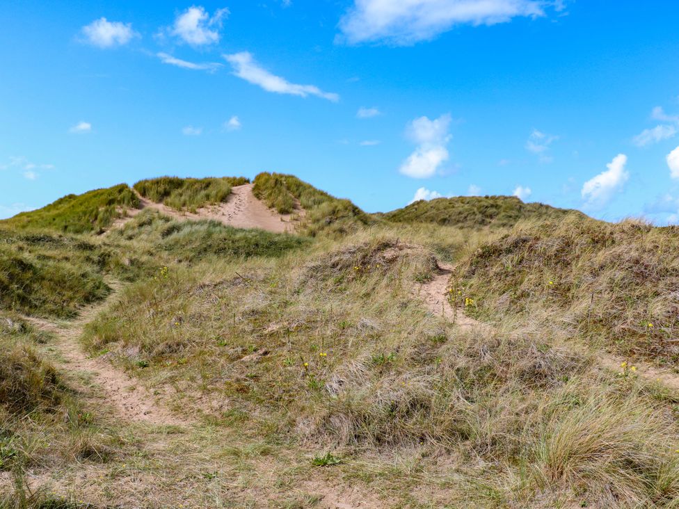 Sand dunes with pathways and grass at Beach House Seaside Dunes in Lytham St. Annes