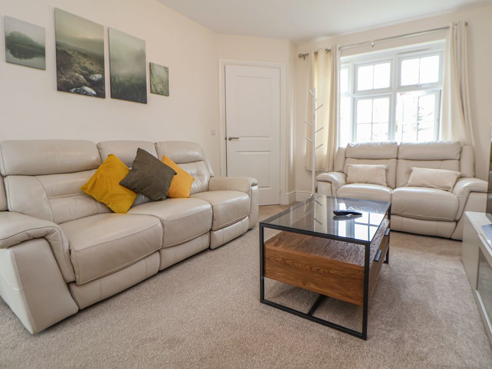 A living room with sofas and a coffee table at 29 Ernest Dawes Avenue Priorslee near Telford