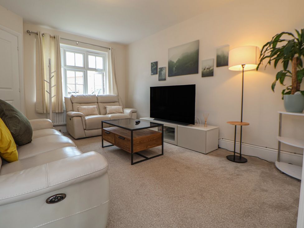 A living room with a sofa and coffee table at 29 Ernest Dawes Avenue Priorslee near Telford