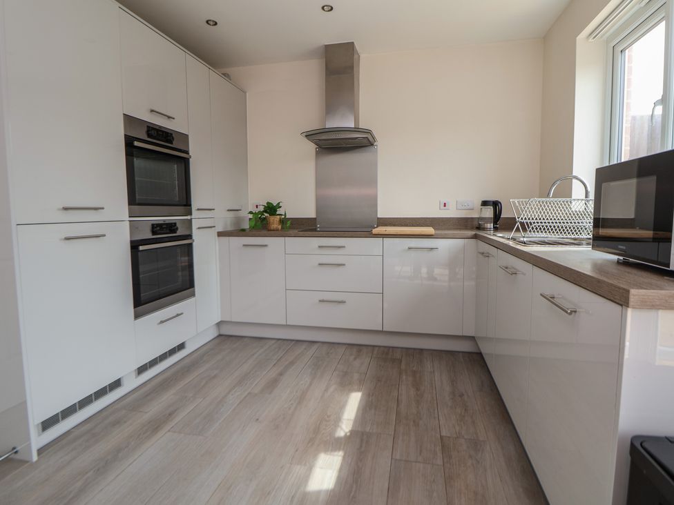 A kitchen with ovens and a sink at 29 Ernest Dawes Avenue Priorslee near Telford