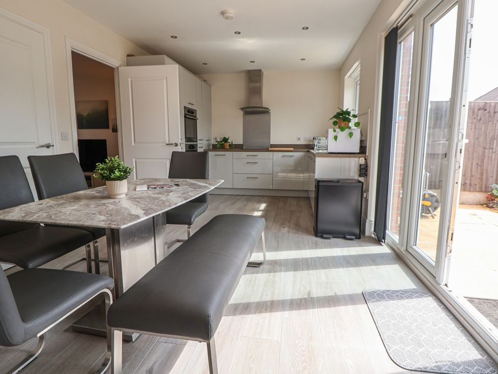 A kitchen with dining table and chairs at 29 Ernest Dawes Avenue Priorslee near Telford