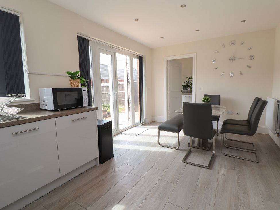 A kitchen with a dining table and chairs at 29 Ernest Dawes Avenue Priorslee near Telford