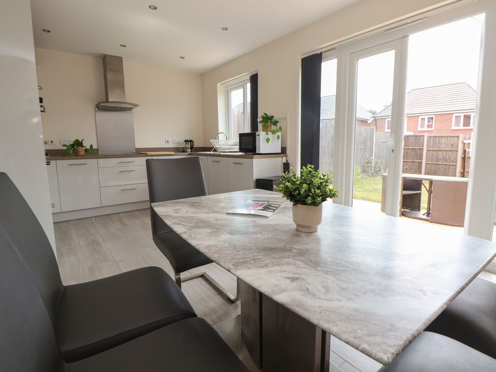A kitchen with a table and chairs at 29 Ernest Dawes Avenue Priorslee near Telford