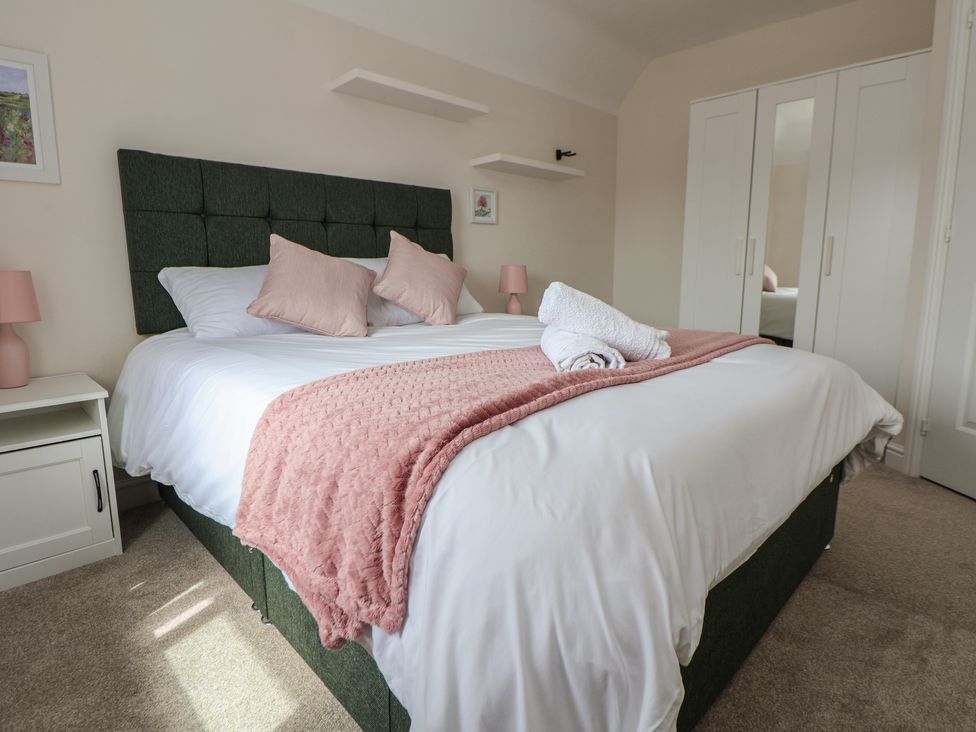 A bedroom with a bed and nightstand at 29 Ernest Dawes Avenue Priorslee near Telford