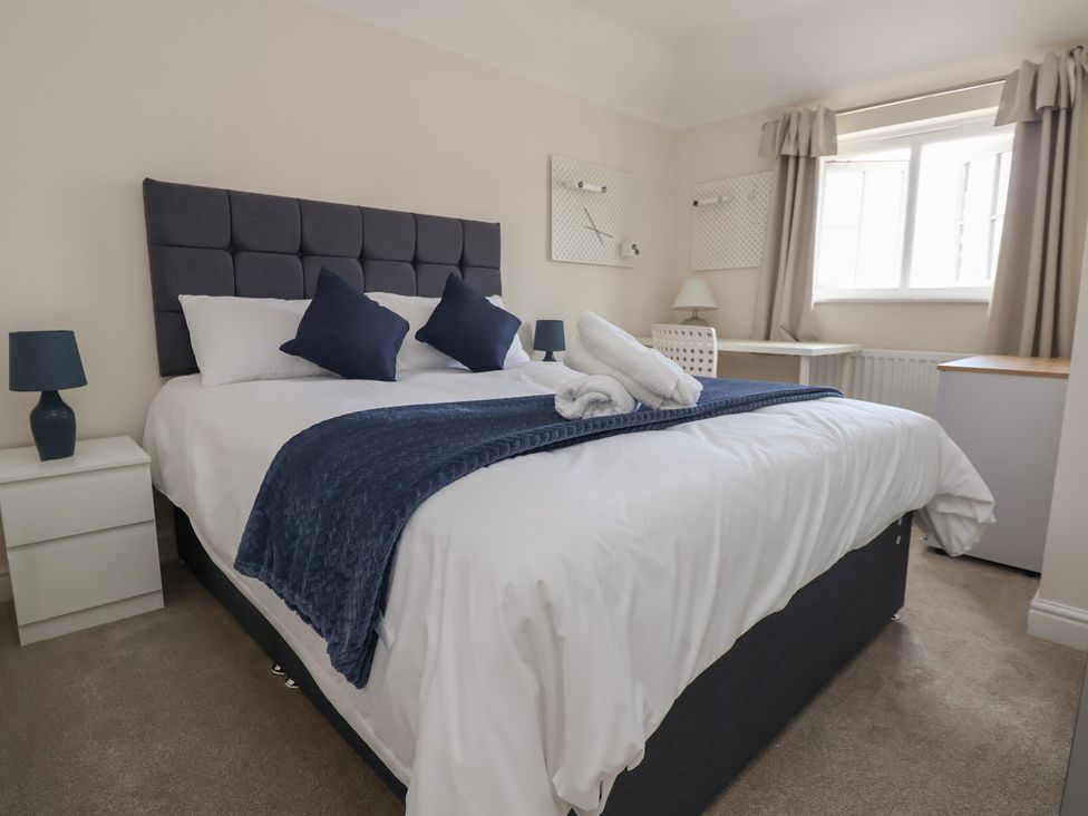 A bedroom with a bed and nightstands at 29 Ernest Dawes Avenue Priorslee near Telford