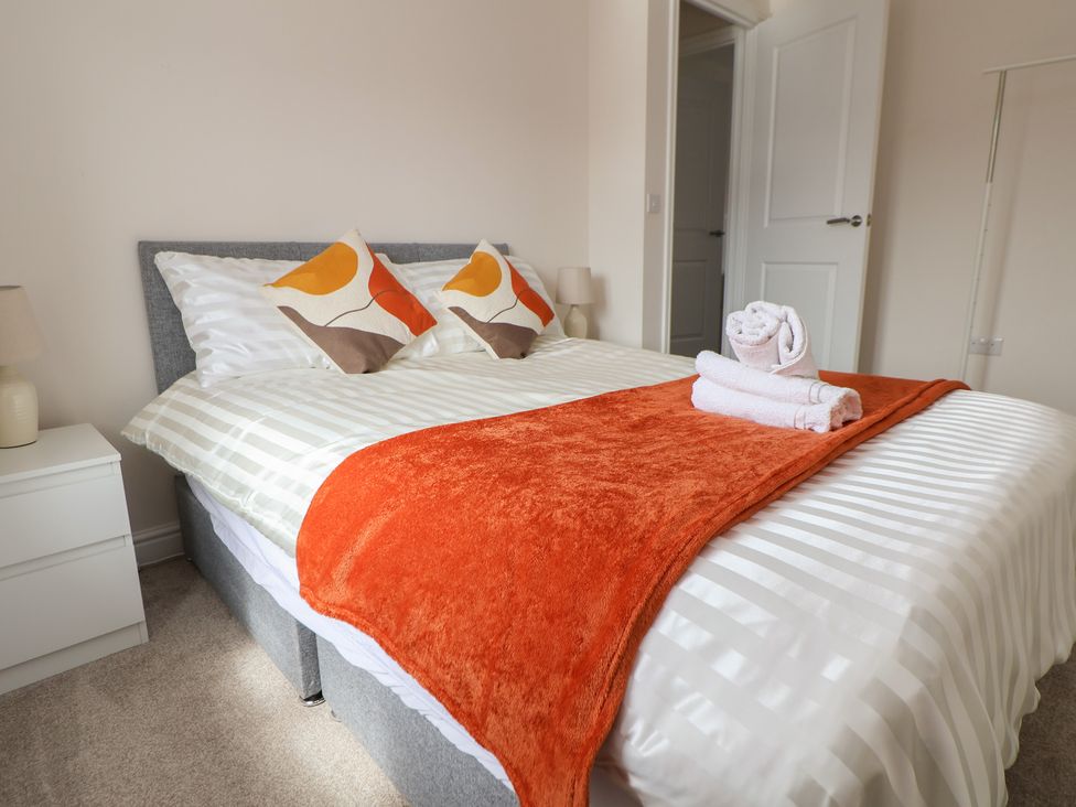 A bedroom with a bed and towels arranged at 29 Ernest Dawes Avenue Priorslee near Telford