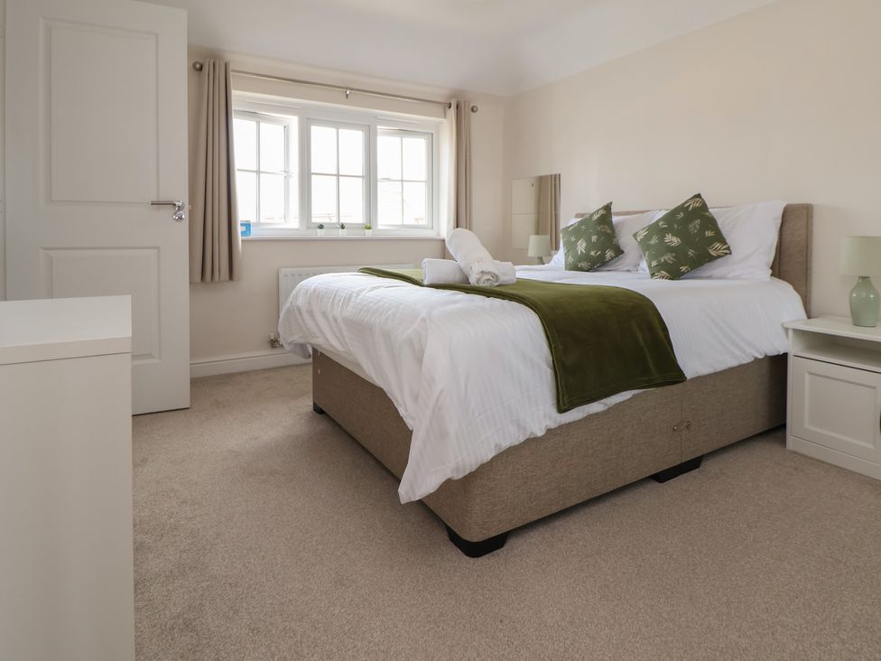 A bedroom with a bed and windows at 29 Ernest Dawes Avenue Priorslee near Telford