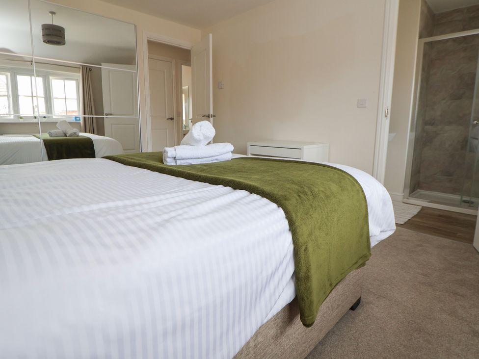 A bedroom with a bed and a shower at 29 Ernest Dawes Avenue Priorslee near Telford