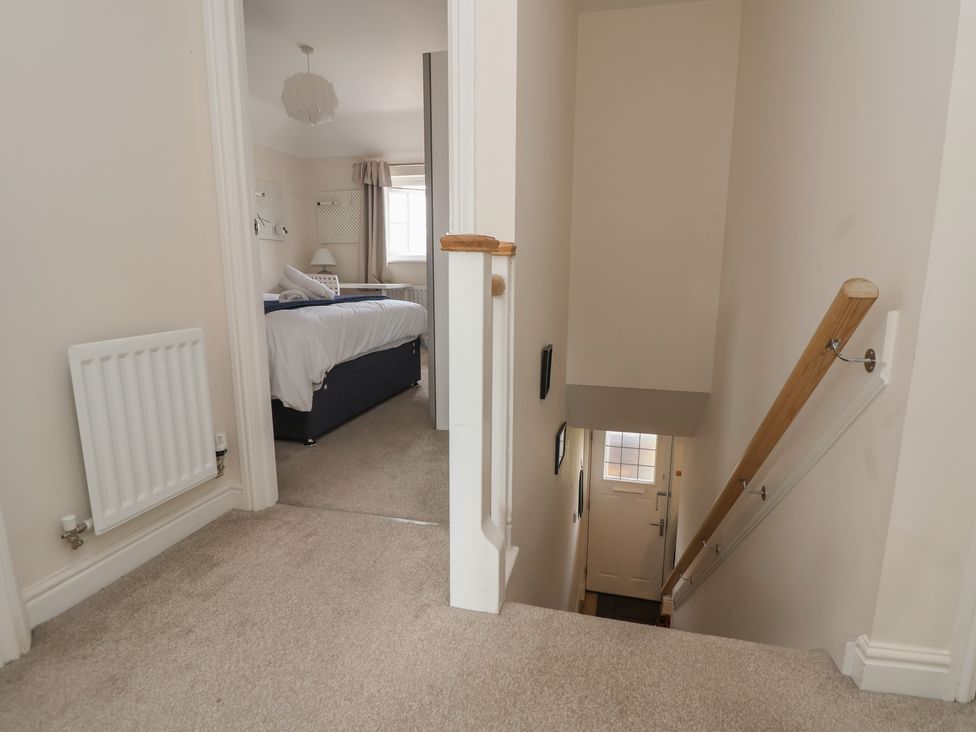 A staircase leading to a door at 29 Ernest Dawes Avenue Priorslee near Telford