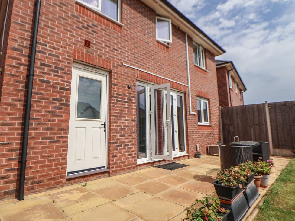 An outdoor area with a patio and doors at 29 Ernest Dawes Avenue Priorslee near Telford