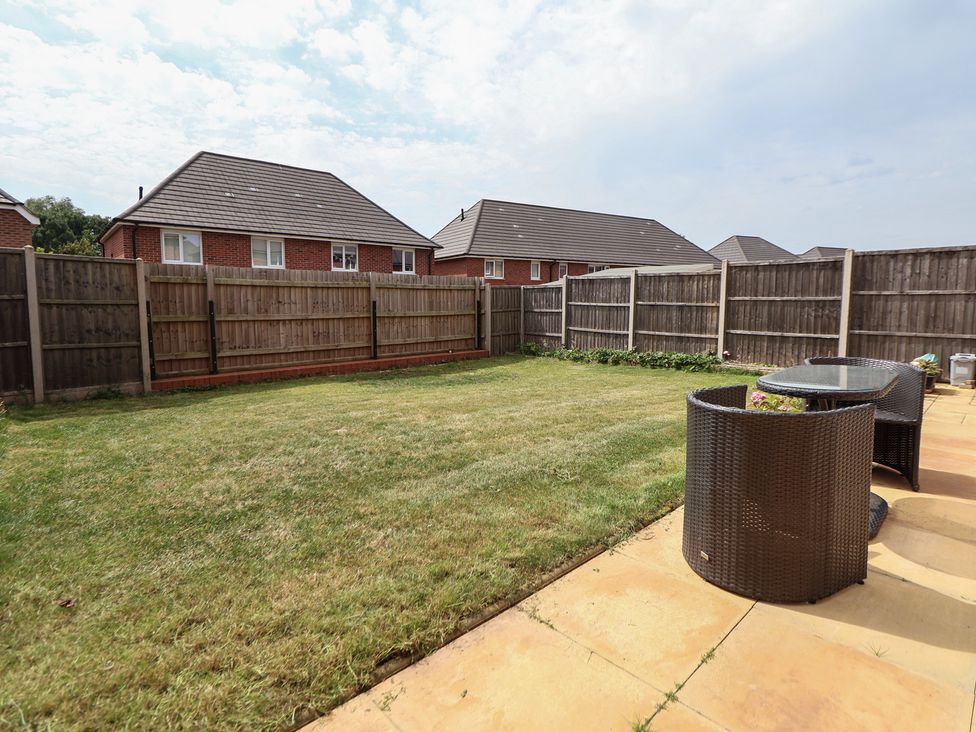 A garden with grass and seating area at 29 Ernest Dawes Avenue Priorslee near Telford