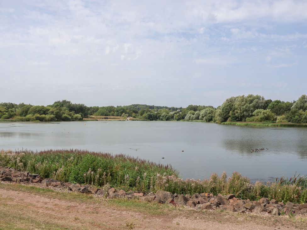A lake surrounded by greenery at 29 Ernest Dawes Avenue Priorslee near Telford