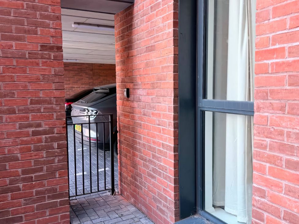 A garage entrance with a car visible at Esther's House in Priorslee near Telford